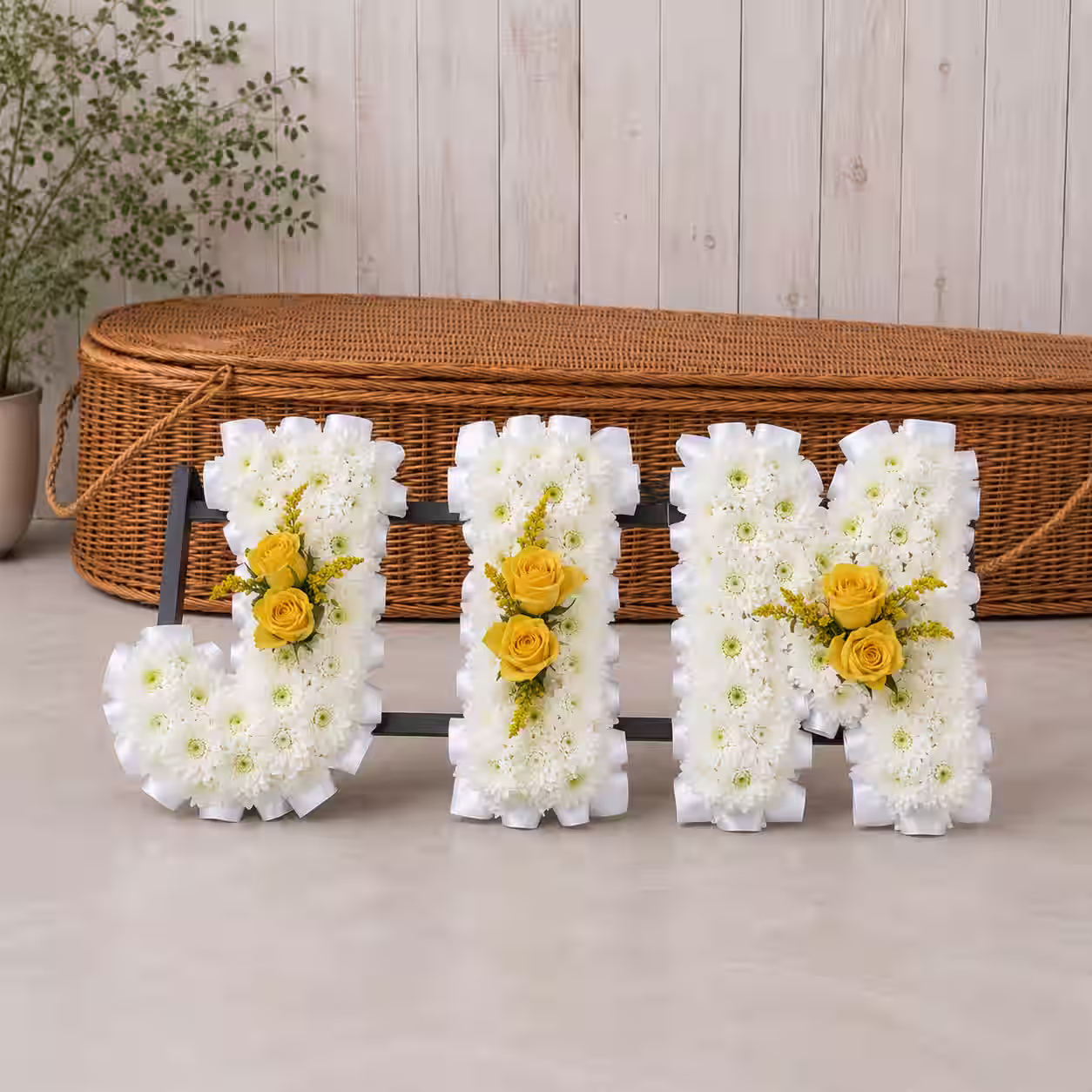 Elegant funeral flower arrangement created by Elsa Brown Flowerstyle